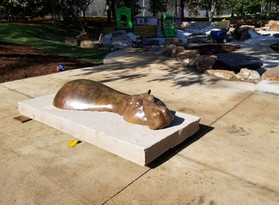 Update 8/28/2018: Our bronze Hippo #RoundBottomusHippopotamus by Tim Cherry Sculpture Designs has found its new home in Riverfront Park. Thanks Sculpture at the River Market and the City of Little Rock, AR #PublicArt #Bronze #Sculpture #Hippo #Bench #RiverfrontPark#LIttleRock #Art This is the National Sculptors' Guild's 499th monumental Public Art Placement!