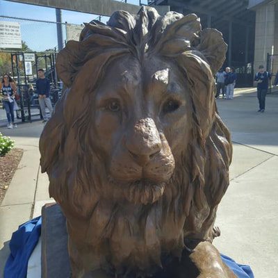 10/22/17: National Sculptors' Guild ﻿John Kinkade﻿ is in NJ for the unveiling of The College of New Jersey’s new Bronze mascot by NSG fellow #HerbMignery. The 8ft Lion served as the official greeter to homecoming fans at the game. The sculpture will be stored until the permanent site at the Brower Student Center is ready in Spring. The sculpture was generously presented to the school by alumnus William McLagan. #GoLions