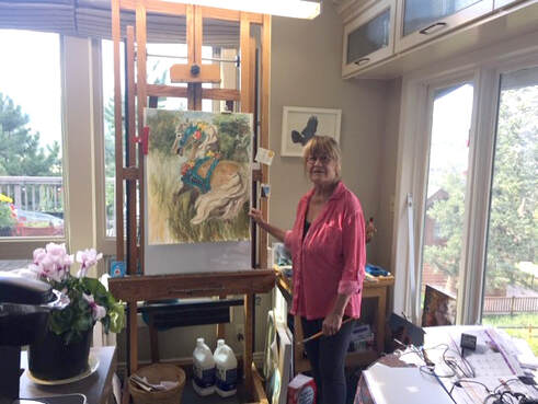 Painter Cathy Goodale at her easel in her Estes Park home. Not a bad place to Stay-at-Home. In addition to her own work, she's been getting creative about how to teach her painting class in a virtual world.