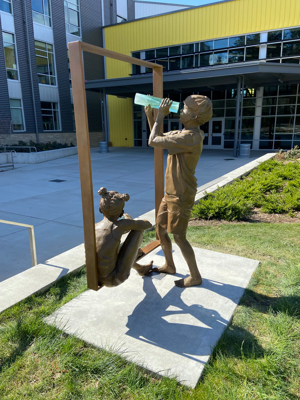 We’ve just installed Macro/Micro Discoveries by Clay Enoch and the National Sculptors' Guild at Surprise Lake Middle School in Milton, WA.
The school is phenomenal and we’re so proud to be a small part of it through this artwork. Special thanks to everyone; Tom, Don, Clint and Mark from @slms.sabers, Mike and Deanne from @artswa, installation expertise from NSG sculptor @markleichliter, @shipperssupplycustompack, @artcastingsco foundry, and last but not least - all the SLMS students that will enjoy this sculpture on their campus. #SculptureIsATeamSport
“Macro/Micro Discoveries” is a statement about the explorative nature of learning, where new worlds open up, big and small, with a simple shift in perspective. The student body is represented by two bronze figures. Glass elements symbolize the abstract subject. The figures are united by a stainless-steel architectural frame, the window to the worlds of discovery.
See more of the process on our site:  http://www.jk-designs-inc.com/.../macromicro-discoveries...
#ClayEnoch #NationalSculptorsGuild #NSG #PublicArt #SLMS #SLMSsabers #SurpriseLakeMiddleSchool #Fife #Milton #Washington #MicroMacro #Discoveries #Bronze #StainlessSteel #Monument #Education #Explore #Wonder  #ArtistDriven #ClientMinded #Celebrating30Years @claysculptor