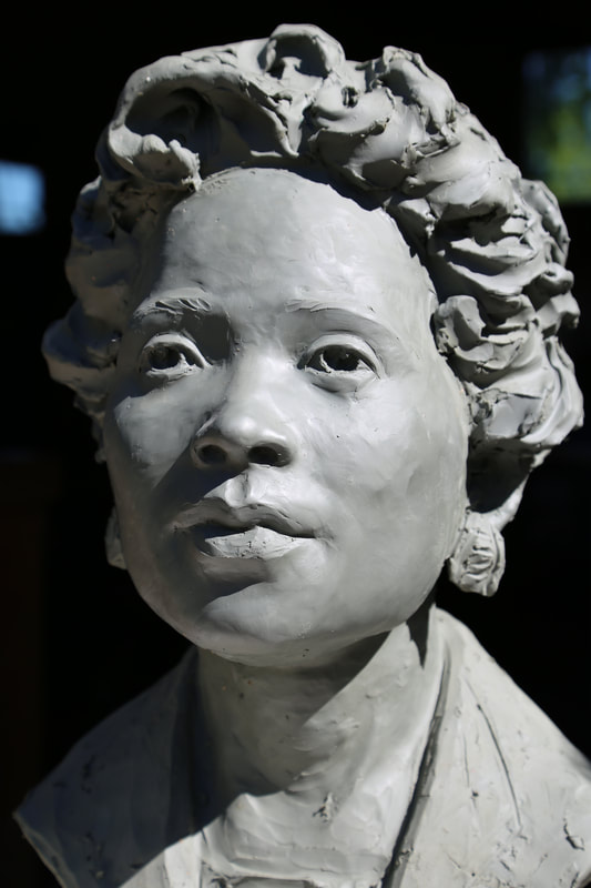 National Sculptors' Guild Fellow Jane DeDecker has been selected to sculpt Daisy Lee Gatson Bates for placement in the City of Little Rock, Arkansas. The honor to portray such an important figure is a true highlight. 

The life-sized bronze bust will be accompanied by bronze plaques featuring quotations by the great Civil Rights Activist.

​The public display of her image and words will serve well to inspire next generations to take her lead to end racial injustice.

​"I have been truly inspired and deeply moved by the strength and dedication of Daisy Lee Gatson Bates. She turned tragedy into her life's work in fighting against prejudice, segregation, and inequality. Daisy Lee Gatson Bates was a formidable woman who would not stand down." - Jane DeDecker, NSG

The commemorative placement will be completed in 2022. Updates will be posted here.
​Daisy Bates was an elegant woman, physically small, though grand in stature when her determination to end racial injustice was involved. She confronted racism and adversity from an early age. Personal confrontations led to speaking out and heading large organizations; providing great change for the state of Arkansas, and beyond.

No one prepares to be the face of change for a nation, Daisy Bates took on her role with grace and fortitude. Unwaveringly, she rose to all of the challenges, her diminutive body seemingly too small for the power she exuded. Small but mighty, Mrs. Bates informed and organized Arkansas' Civil Rights movement.

Her resilience to the fear tactics used gave her a reputation of calm in the face of adversity. Jail time, fires on lawns and bricks thrown through windows seemed only to make the fight more just and purposeful.

Though Mrs. Bates is most known for her involvement in the Little Rock Desegregation Crisis of 1957, her contributions etch far deeper. The weekly newspaper that she and her husband published helped inform and activate civil rights movements across the state, and beyond, before and after the integration of Central High School. From 1941 to 1959 the Arkansas State Press was one of the only newspapers solely dedicated to the Civil Rights Movement.

She was known to publish controversial articles that others shied away from. Daisy Bates worked with local Civil Rights organizations including joining the National Association for the Advancement of Colored People in 1952. For many years, she served as the President of the Arkansas chapter of the NAACP, providing support to many opportunities for the black community, assuring her role in the 1957 desegregation efforts.
​
She was well respected in the community, even her opponents had to admit she was a force to reckon with. Her repose during crisis after crisis kept the forward motion of the Civil Rights Movement going; and her tenacious charge afforded generations of students access to their constitutional rights.