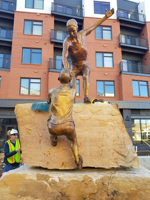Update 11/20/2018: We were downtown completing the installation this afternoon.

​The bronze is in! "Reaching Our Goal" by Denny Haskew and the National Sculptors' Guild is the final element to go in of The Rotary Club of Thompson Valley's Legacy Project at The Foundry 
​​
The Legacy Project is the National Sculptors’ Guild’s 500th Public Art Placement!

We are so excited to be celebrating this moment in Loveland, Colorado where we've been headquartered since 1992.

​We have donated our portion of the project back to the placement to give back to the community that has supported us through the years.

 #FullCircle #ReachingOurGoal