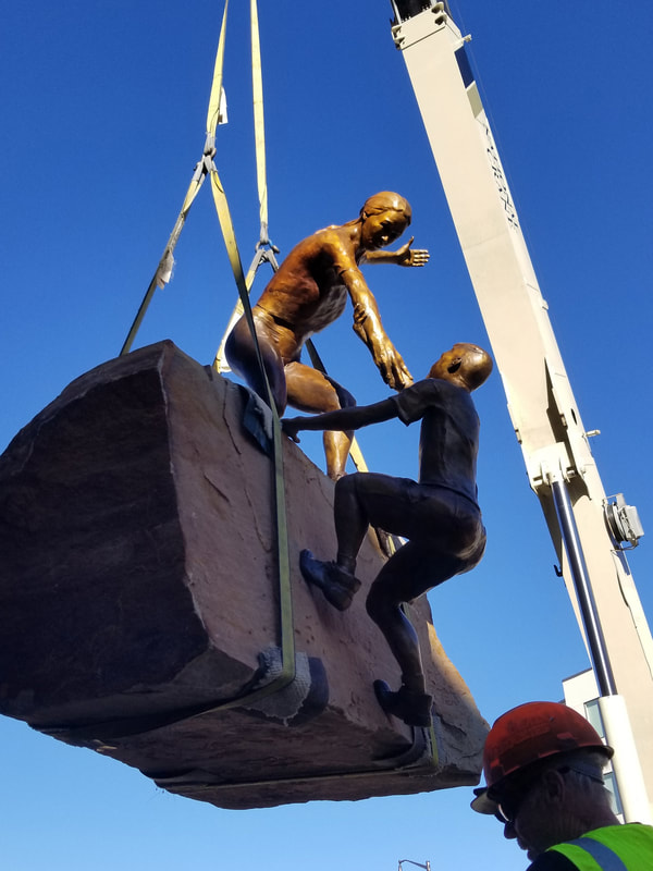 Update 11/20/2018: We were downtown completing the installation this afternoon.

​The bronze is in! "Reaching Our Goal" by Denny Haskew and the National Sculptors' Guild is the final element to go in of The Rotary Club of Thompson Valley's Legacy Project at The Foundry 
​​
The Legacy Project is the National Sculptors’ Guild’s 500th Public Art Placement!

We are so excited to be celebrating this moment in Loveland, Colorado where we've been headquartered since 1992.

​We have donated our portion of the project back to the placement to give back to the community that has supported us through the years.

 #FullCircle #ReachingOurGoal

