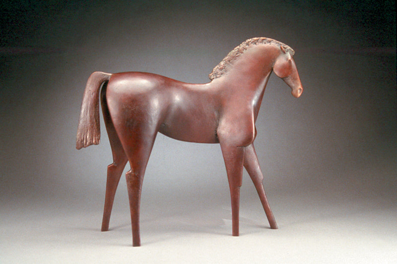 Bonnie Gangelhoff / Southwest Art Jul 01, 2004

Sculptor Carol Gold wrings strong emotions from her sleek bronze figures

EVERY JANUARY, California sculptor Carol Gold settles into her studio to begin the year anew with fresh ideas for her bronze pieces and a chunk of soft, hot wax with which to give them shape. Her ideas about the forms that will occupy her heart and hands over the next 12 months have percolated in her thoughts to some degree, but arise mostly from the unconscious, Gold says.

She squeezes, manipulates, and molds the wax, roughing in shapes as figures emerge-some large, some small, some flat, some rounded. Most of her forms represent the human figure, with the exception of a horse or two. "I think inspiration comes from a lot of places-from where I am emotionally as well as from nature," Gold explains from her airy, 770-square-foot studio perched on a hillside in Northern California. "My work is also informed by what`s going on in the world and what I read."

Last year, for instance, Gold says her work was directly affected by the turmoil in the world, including the U.S. invasion of Iraq and the events leading up to it. "I had this feeling all last year that what I needed to do was create tranquil pieces," she says. "Some artists may respond to what`s going on in the world with anger, but I just can`t do that. I needed my sculptures to be an antidote to the chaos."

TRANQUILITY and EMBRACE, both created in 2003, are two of her most peaceful pieces-ones that Gold describes as "calm and loving." In TRANQUILITY, a relaxed figure sits staring into space as if looking out a window on a beautiful day. In EMBRACE, two people wrap their arms around each other in a display of tender affection. The latter bronze also is an example of how Gold is influenced by what she reads. After finishing the book War is a Force That Gives Us Meaning [2003 ANCHOR] by Chris Hedges, the sculptor was deeply moved by one of the points the author kept stressing. Hedges, a veteran war correspondent for The New York Times, explains in the book that while covering many wars and trying to survive in various war zones-including being ambushed in Central America and imprisoned in the Sudan-the only place he ever felt safe was in the home of a loving couple or family. "EMBRACE came out of that sense of a safe place in the midst of war," Gold says.

Of the many themes woven through Gold`s work, perhaps the most common is communication. Her sculptures often include two figures as in EVENING WALK, ARTTALK, and FIESTA. The moods the sculptor evokes in these twosomes are amazingly varied-from the contemplative, restful depiction of a couple strolling in EVENING WALK to the joyous dance captured in FIESTA. Gold manages to squeeze living, breathing emotion out of cold, hard bronze, whether it`s tenderness of spirit as in EMBRACE or the arrogant poses of two figures in ART TALK.

THERE ARE FEW CLUES in Gold`s sophisticated pieces to reveal her personal roots. Her sleek, contemporary figures are a far artistic cry from growing up on a dairy farm in western Massachusetts. About the only trace of her childhood that a viewer glimpses is through the horses that emerge in her work every now and then. As a girl, Gold spent countless hours riding through the countryside, enjoying the calm and solitude. "I would get on my horse, and all of my anxieties would melt away," she recalls. Today her bronze equines are remnants of those bygone days. Now, as then, the horses represent freedom to the artist. "They were my only mode of escape as a child," she explains.

In addition to a fondness for roaming the countryside on her horse, Gold`s other main interests in her youth were drawing and poring over her parents` book on the history of painting. "At one point my mom gave me art lessons, but I was always more interested in animals," she recalls.

When she headed to Cornell University in Ithaca, NY, Gold was bent on studying veterinary medicine. But her entire world spun in a different direction one day when she signed up for an art history class. After a few hours in class, she was sure that all she ever wanted to pursue was art. Gold quickly changed her major to art and architecture but encountered some rocky patches in subsequent classes. She wanted to learn more about technique, but it was fashionable in the art department then to focus on self-expression. Married at the time, Gold and her husband moved to Boston, MA, after three years at Cornell. She transferred to Boston University, where her artistic desires were met with a more welcome attitude in the fine-arts department. "It was a breath of fresh air," Gold says. "I just wanted to learn the basics like stretching canvas and printmaking first, just the tools I needed in the beginning."

In 1968 Gold moved to California, where she has remained ever since. When her four children were young, she worked at their elementary school as an assistant to a sculpting teacher. By 1972 she was sculpting full time, working first with clay. Three-dimensional forms have always held more allure for Gold, moving her in a way that painting and other two-dimensional artworks have failed to do. Likewise, figures in art have usually had an emotional impact on her, while nonobjective art rarely engages her with quite the same intensity.

Gold`s work has evolved over the past two decades as she moved from clay to wax about 10 years ago. "Clay was too earthbound," she says. "Wax gives me a chance to be more expressive in my forms." While experimenting with wax she has developed a technique for incorporating pieces of burlap, which allows her to fully realize one of what she calls her "two basic sculpting vocabularies"-flat, nude figures and draped figures. Because wax is easier to manipulate than clay, the material goes a long way in helping Gold convey emotions and mood. And using wax enables her to "sketch in" figures rapidly when her ideas are taking shape at the beginning of the year. The sculptor creates about 30 such shapes, but by the end of the year only six or seven will survive and be cast in bronze. "They need to really strike me as far as the mood I am trying to convey, or I will throw them away," she says.

Another signature Gold element is the stunningly rich patinas on her bronze pieces, in colors that range from earthy gold and copper tones to various shades of turquoise that often evoke a southwestern flavor. As this story went to press, the sculptor was preparing works for the prestigious Sculpture in the Park show, held every August in Loveland, CO [see page 74]. Her piece FIESTA is also scheduled for installation in Lovelanci`s Benson Sculpture Park this summer.

Gold isn`t fond of speculating about what ideas she will explore in the future, except to say that communication is always a reoccurring theme. For now, she`s content to read, share opinions, pay attention to the world at large, and have faith that when a hunk of wax is set before her, her unconscious will light the way.

Gold is represented by Bronze Coast Gallery, Cannon Beach, OR; Savage Stephens Contemporary Art Works, Carmel, CA; Coda Gallery, Palm Desert, CA, and New York, NY; and Columbine Gallery, Loveland, CO, and Santa Fe, NM.

SIDEBAR

"I think inspiration comes from a lot of places-from where I am emotionally as well as from nature."

ILLUSTRATIONS

EMBRACE, BRONZE, 14 × 7 × 3 ½.

FIESTA, BRONZE, 29 ½ × 36 × 9.

CAROL GOLD

ART TALK, BRONZE, 17 × 15 × 8.

CELEBRATION, BRONZE, 19 ½ × 12 × 6.

KOBILA, BRONZE, 23 × 25 × 9.

AUTHOR AFFILIATION

Bonnie Gangelhoff is the senior editor of Southwest Art.

COPYRIGHT: Copyright Sabot Publishing, Inc. Jul 2004. Provided by Proquest- CSA, LLC. All Rights Reserved. Only fair use as provided by the United States copyright law is permitted.