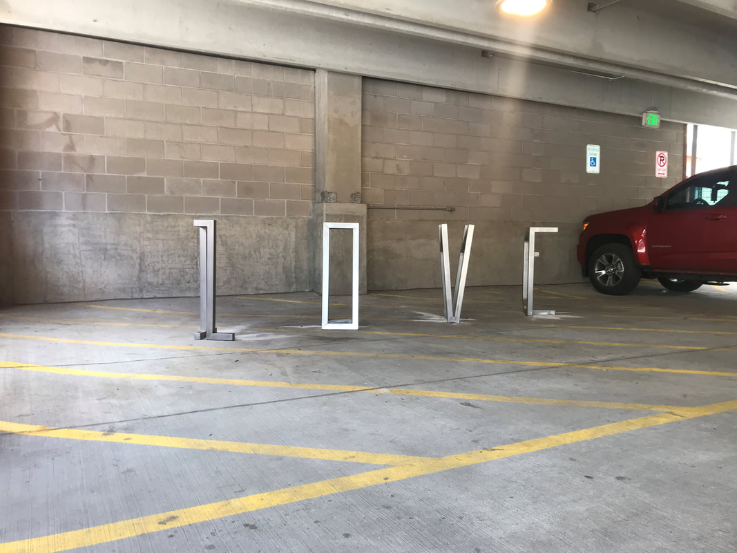 Joe Norman just installed a new bike rack in downtown Loveland. It's located at Patina Flats at The Foundry. Next time you bike downtown use it to lock up. #LOVEland #BikeRack  Need one for your neighborhood? contact us to commission one