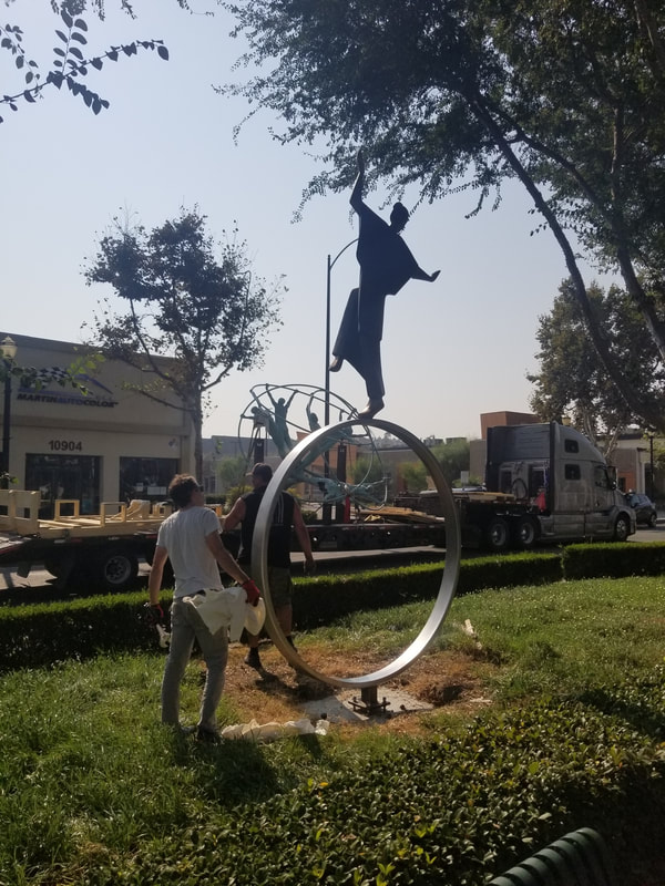 The National Sculptors' Guild is in Downey, California today, installing four public art sculptures. It’s going well and the artwork looks fantastic in place. Thanks NSG Fellow Clay Enoch for the extra help!
#PublicArt #NationalSculptorsGuild #SculptureIsATeamSport #CarolGold #NSG #DowneyCa #Sculpture #Installation
