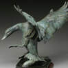 Wildlife bronze sculpture by SANDY SCOTT available at Columbine Gallery home of the National Sculptors' Guild Colorado's Largest Fine Art Source Specialists in Public Art A licensed pilot for more than thirty years, she feels her knowledge of aerodynamics has been helpful in achieving the illusion of movement in her bird sculpture. The Thomas Gilcrease Museum honored Sandy with a major retrospective exhibition in “Rendezvous ‘98”. Spirit of the Wild Things, a book about Sandy’s work was published the same year. Congratulations to Sandy for her recent accolades from the Briscoe Western Art Museum, honoring her with the Legacy Award. Sandy Scott received her formal art training at the Kansas City Art Institute and later worked as an animation background artist for the motion picture industry. She turned her attention to etchings and printmaking in the 1970’s and to sculpture in the 1980’s. Born in Dubuque, Iowa in 1943 and raised in Tulsa, Oklahoma, she is now headquartered in Lander, Wyoming near the foundry that casts her bronzes and she maintains studios on Lake of the Woods, Ontario, Canada and in the mountains of northern Colorado. Surrounded by mountains, lakes and streams, she is an avid outdoorswoman who loves to hunt and fish. In Canada her friends Dave and Michelle Beaushane who own Nestor Falls Fly-In Outposts frequently fly her and Trish (her long time friend who manages the business end of things) to remote lakes and portages north of Kenora, Ontario. She has made 16 trips to Alaska and has been to Europe, Russia, China and South America to visit the world’s great museums. She believes wildlife artists should be in the field to accurately present their subject to the viewer. Her work is authentic. She has experienced and lived what she depicts.