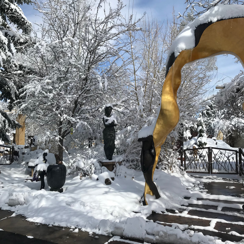 April Showers??! Sometimes the showers involve snow. 
What a difference a day makes! The National Sculptors' Guild Sculpture Garden is looking really different today from what it did on Tuesday.

We can't wait to see how this big wet snow helps the flowers coming up... the forsythia didn't fair well.

#SpringInColorado #PoorForsythia #AprilBlizzard