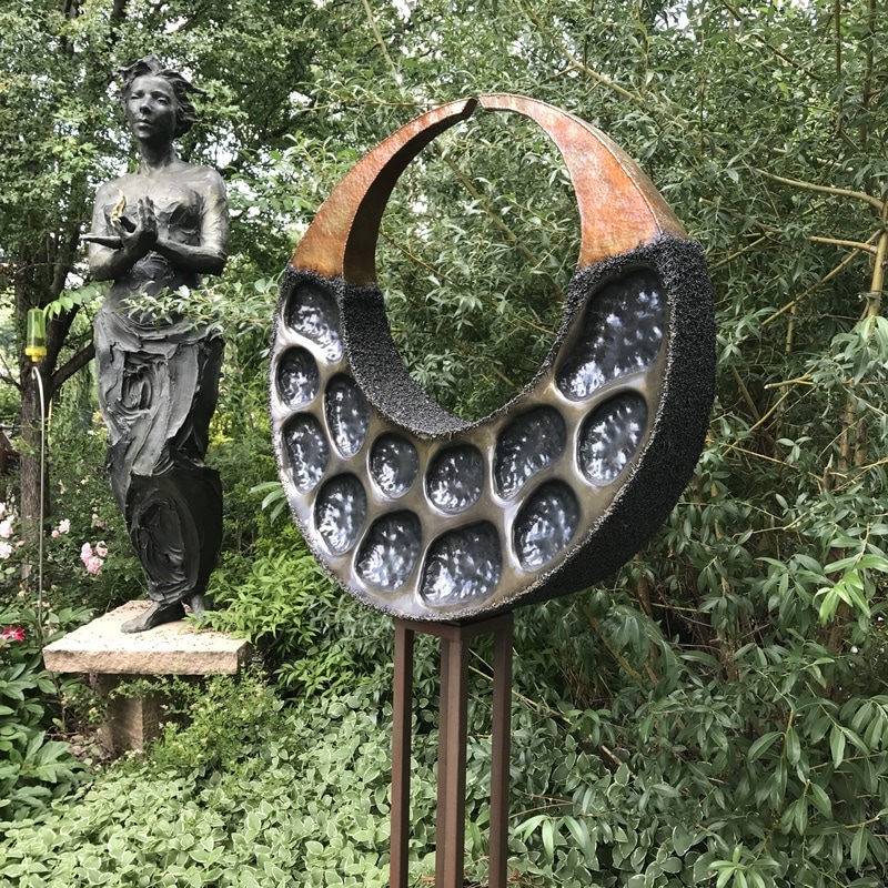 Stephen Shachtman's Lunar Acorn shown with Jane DeDecker's Fire. The National Sculptors' Guild Sculpture Garden is filling up for summer with new sculpture and blossoms. We are pleased to have three new pieces from Stephen Shachtman. click the images below to shop online.