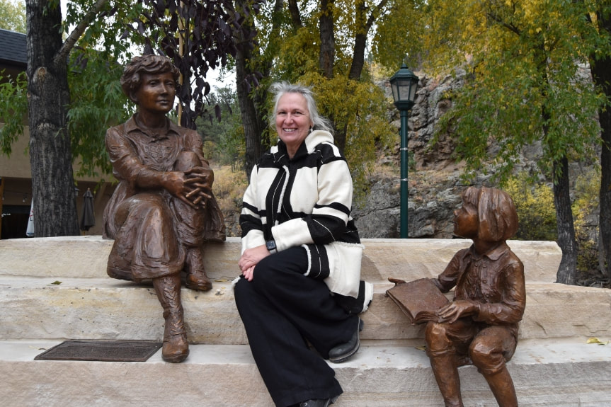 NSG Fellow, Jane DeDecker continues to amaze us with her recent monuments to women in Seneca Falls and now Estes Park. She is making history as she honors these historic figures, bringing to light the contributions of phenomenal women, sculpted by a phenomenal woman. This link has some great pics of the artist and includes some connections to the subjects. https://www.eptrail.com/.../10/01/womens-monument-dedicated/ ​ By WENDY RIGBY | wrigby@eptrail.com | Estes Park Trail-Gazette PUBLISHED: October 1, 2021 at 1:15 p.m. | UPDATED: October 4, 2021 at 10:57 a.m.On a chilly autumn afternoon, a large crowd gathered to participate in the dedication of the Estes Park Women’s Monument. The statues sit on a piece of land donated by the Town of Estes Park along the river walk. Twelve historical and current female leaders who have impacted the town’s rich heritage are honored in this newest public art installation. “This was a widespread, grassroots effort,” said Ron Wilcocks, Chairman of the Estes Park Women’s Monument Committee. “Hundreds of people helped make it happen. The community came through in a big way.”  Speaking on behalf of the Estes Park Woman’s Club, Judy Schaffer commented, “These were not just ladies who sat around. They laid trails. They funded libraries. The supported the town as a community. They gave a legacy to the more contemporary women we are honoring.” Members of the Town Board of Trustees were there, along with Mayor Wendy Koenig who is one of the 12 women honored in bronze sculpture.  ​“This is a momentous occasion,” Koenig noted. “This monument makes visible the women who nurtured this community.” Town Administrator Travis Machalek called the monument “long overdue.” The centerpiece figure of the picture is Eleanor Hondius, an early female leader in Estes Park. Her son, 97-year-old Pieter Hondius who still lives in Estes Park, was on hand to see his mother honored in this lasting way.  “These were strong-minded, determined and focused women,” she said. “We owe a debt to these pioneers for what Estes Park is today.” Noting that creating public sculptures is a “team sport,” DeDecker thanked all of the donors who collectively contributed more than $100,000 for the project. She also thanked the town employees who helped prepare the site and will keep it beautiful year round.